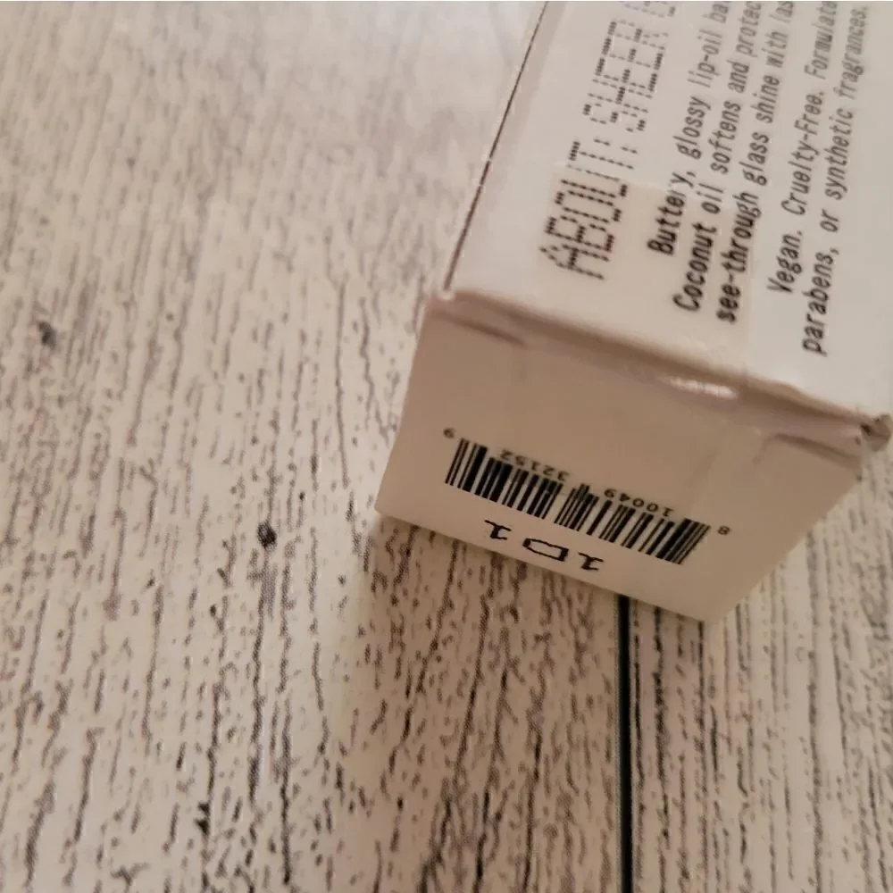 About Face Light Lock Lip Gloss in Angel on Fire